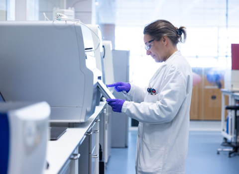 A scientist performing digital PCR analysis